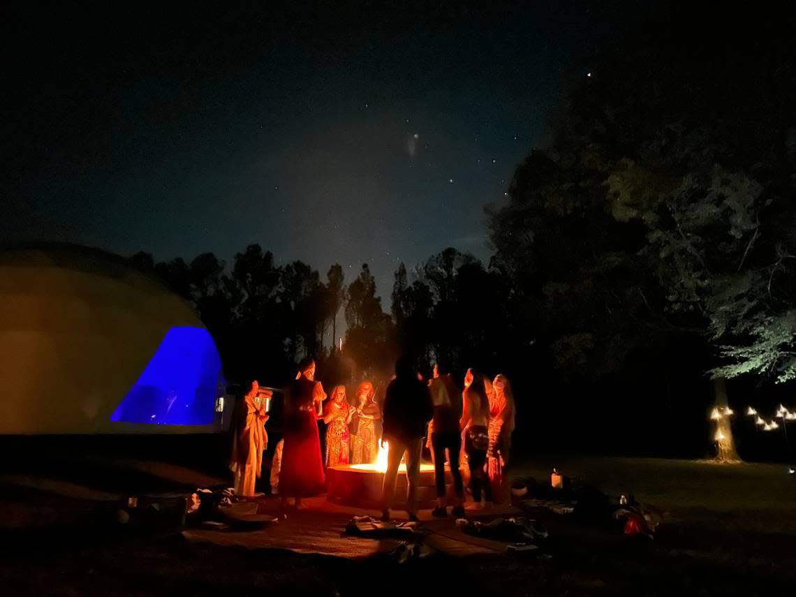 Guests enjoy an evening around the fire pit at retreat and event venue business The Florrest located in Hillsboro, GA. Courtesy The Florrest