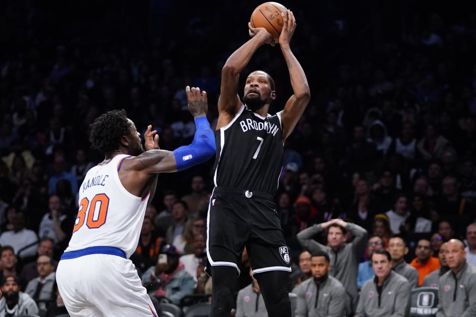 Brooklyn Nets' Kevin Durant (7) shoots over New York Knicks' Julius Randle (30) during the second half of an NBA basketball game Wednesday, Nov. 9, 2022, in New York. The Nets won 112-85. (AP Photo/Frank Franklin II)