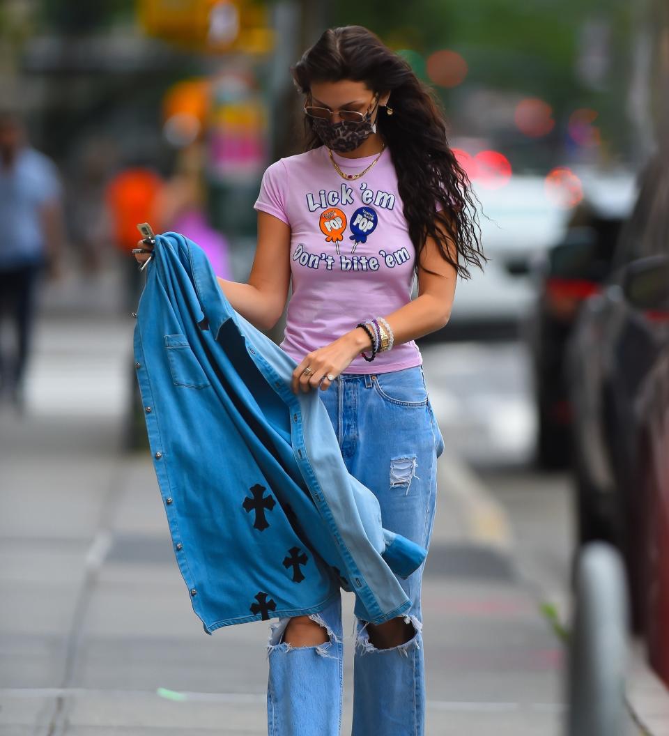Bella Hadid in a pink tee and jeans