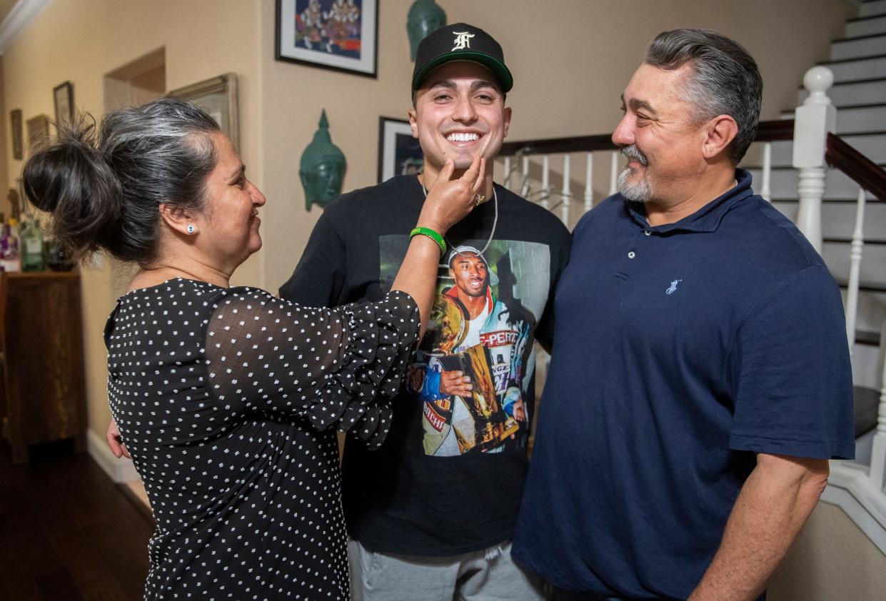 Kamni and Mark Del Barbawith their son  Dez Del Barba at their Stockton home. Dez became ill with a flesh-eating bacteria five weeks into Army basic training at Fort Benning in Georgia in 2019. He had his left leg amputated and skin grafts over 55% of his body. Kamni Del Barba took the photos to Washington D.C. to lobby lawmakers for help for her son, Oct. 20, 2022.