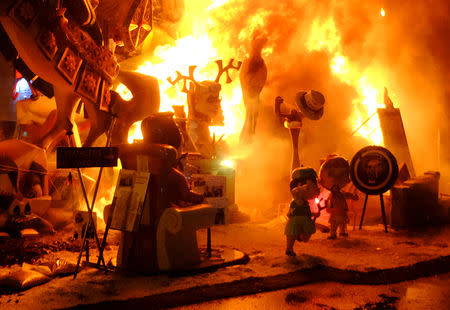 Figures that are part of a Fallas monument burn during the finale of the Fallas festival, which welcomes Spring and commemorates Saint Joseph's Day, in Valencia early March 20, 2019. REUTERS/Heino Kalis