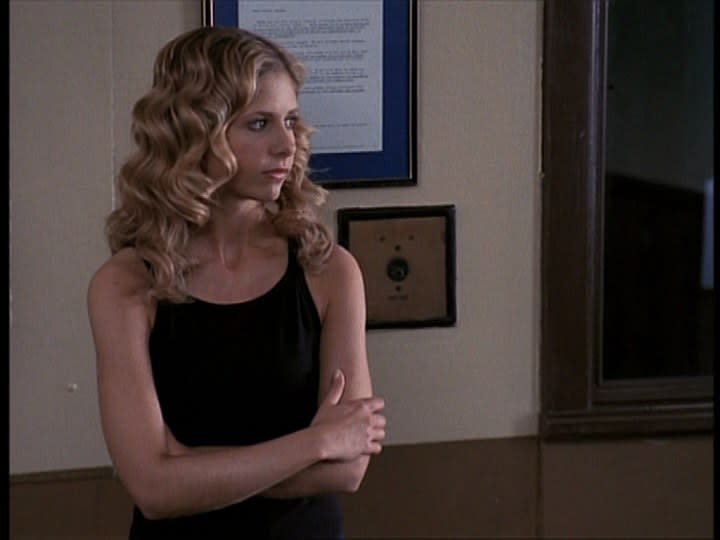 Buffy Summers stands in Angel Investigations in the episode "Sanctuary"