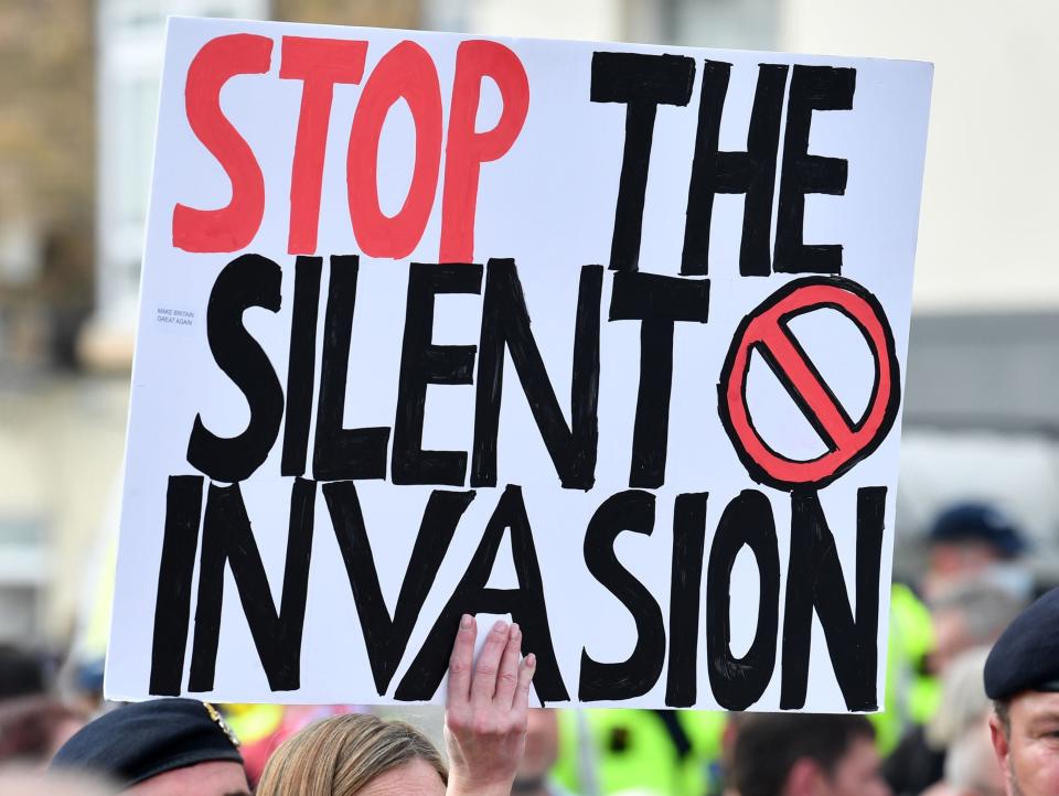  An anti-immigation protester holds up a placard during a demo in Dover on the south-east coast of England, on September 5, 2020 (AFP via Getty Images)