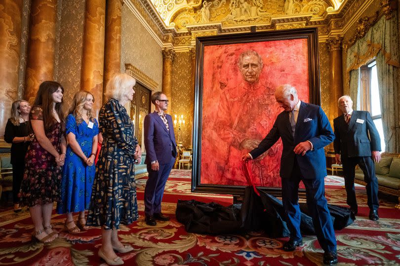 King Charles III and Queen Camilla at the unveiling of artist Jonathan Yeo's portrait of the King, in the blue drawing room at Buckingham Palace, London