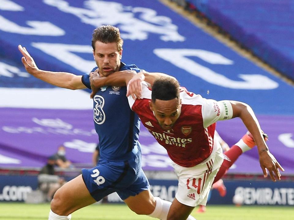 Cesar Azpilicueta brings down Pierre-Emerick Aubameyang in the Chelsea box for a penalty: Arsenal FC via Getty Images