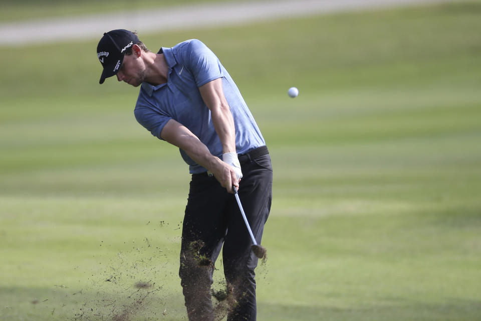 Thomas Pieters of Belgium play his shot on the 17th hole at the Malaysia Golf Championship 2nd round in Kuala Lumpur, Malaysia, Friday, March 22, 2019. (AP Photo/Vincent Phoon)