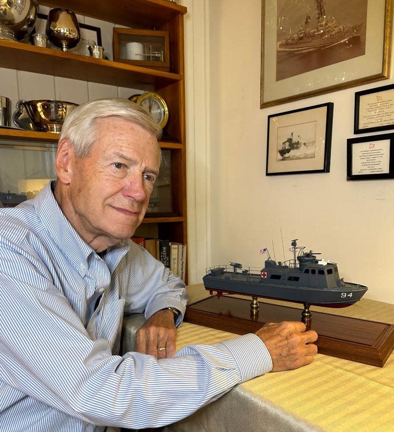 Retired Navy Capt. David Brown displays a model of a Swift Boat at his home in Middletown.