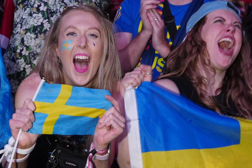 Swedish Eurovision fans in the Fan Zone react as Loreen of Sweden wins Grand Final of the Eurovision Song Contest in Liverpool, England, Saturday, May 13, 2023. (AP Photo/Jon Super)