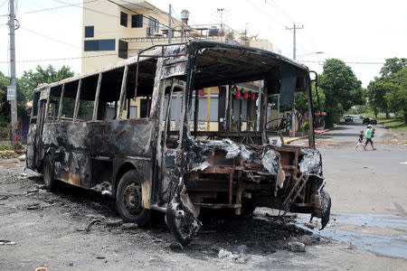 A burned bus is seen during a protest against Nicaragua's President Daniel Ortega's government at neighborhood in Managua, Nicaragua June 15, 2018.REUTERS/Oswaldo Rivas