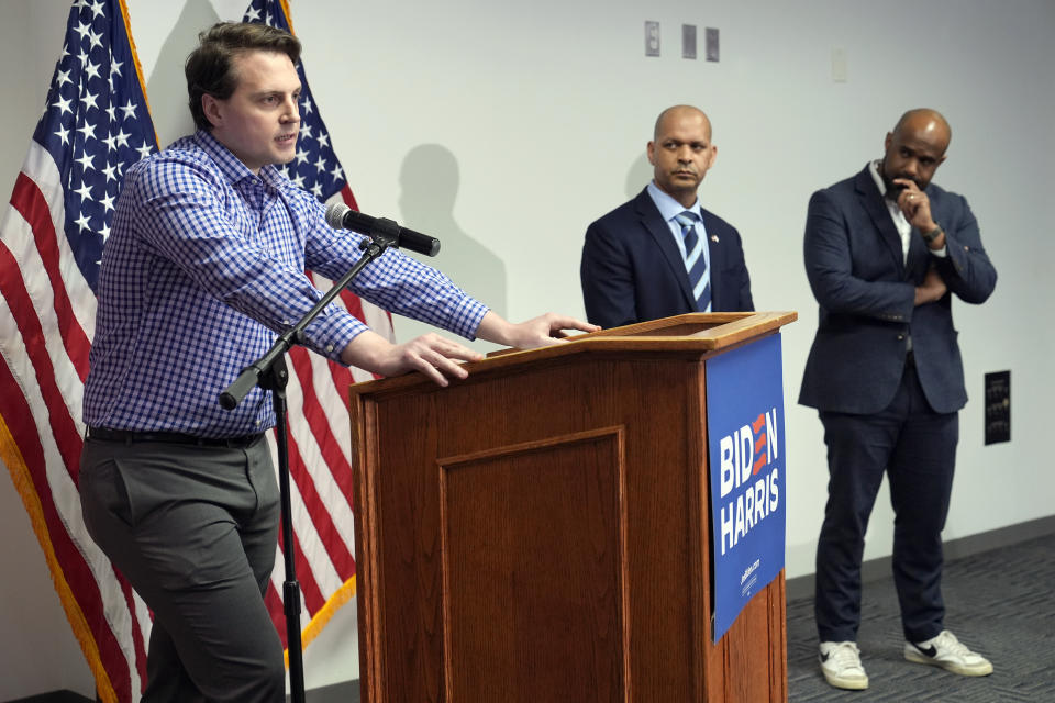 FILE - Washington Metropolitan Police officer Daniel Hodges speaks during a news conference at the Democratic National Committee Headquarters in Washington, April 1, 2024, as former Capitol Police Sgt. Aquilino Gonell, center, and Biden-Harris communications director Michael Tyler, right, listen. Hodges and Gonell both were working and responded to the riot on Jan. 6, 2021, at the U.S. Capitol. (AP Photo/Susan Walsh, File)