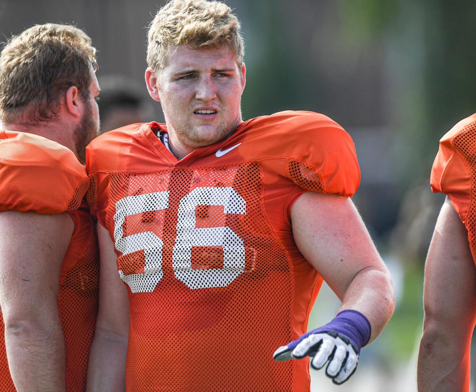 Clemson offensive lineman Will Putnam (56) is doing "thousands and thousands" of snaps as he moves to center this spring.