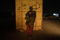 A Taliban fighter poses for a photo at a check point in Herat Afghanistan, on Saturday, Nov. 27, 2021. Since the Taliban's takeover of Afghanistan just over three months ago amid a chaotic withdrawal of U.S. and NATO troops, its fighters have changed roles, turning from fighting in the mountains and the fields to running the country. (AP Photo/ Petros Giannakouris)
