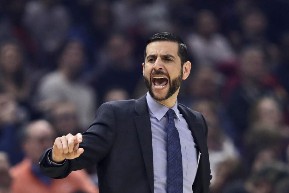 Charlotte Hornets head coach James Borrego yells instructions to players in the first half of an NBA basketball game against the Cleveland Cavaliers, Thursday, Jan. 2, 2020, in Cleveland. (AP Photo/Tony Dejak)