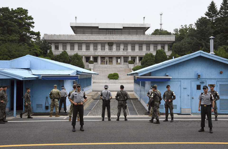 FILE - Soldiers of South Korea and the U.S. stand guard during a commemorative ceremony for the 64th anniversary of the signing of the Korean War Armistice Agreement at the truce village of Panmunjom in the Demilitarized Zone (DMZ) dividing the two Koreas on July 27, 2017. The truce that stopped the bloodshed in the Korean War turns 70 years old on Thursday, July 27, 2023 and the two Koreas are marking the anniversary in starkly different ways, underscoring their deepening nuclear tensions. (Jung Yeon-Je/Pool Photo via AP, File)