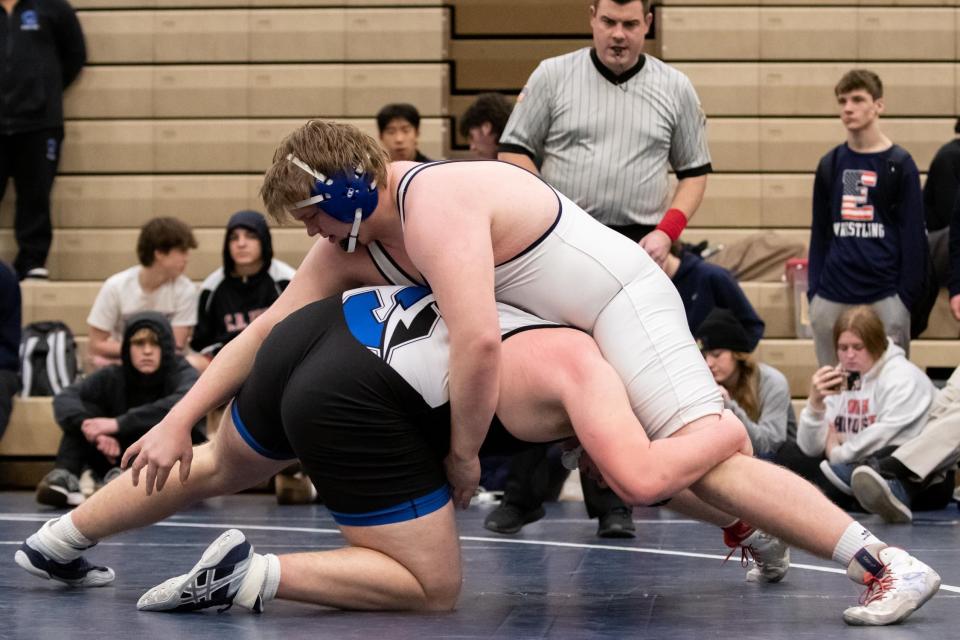 Central Bucks East's Joe Collins (top) and CB South's Collin Goetter are two of the top area wrestlers and offensive linemen.