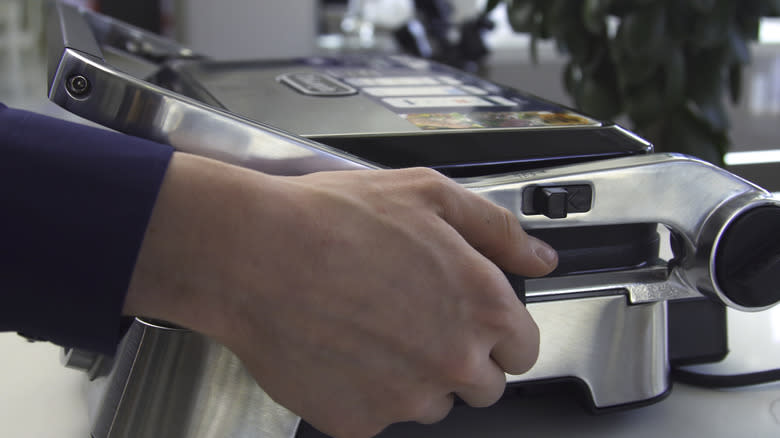 Electric panini press with hand