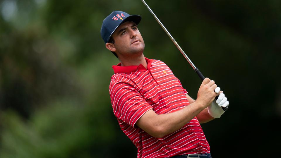 Scottie Scheffler hits from the sixth tee during their singles match at the Presidents Cup golf tournament at the Quail Hollow Club on Sept. 25, 2022, in Charlotte, N.C. (AP Photo/Julio Cortez)