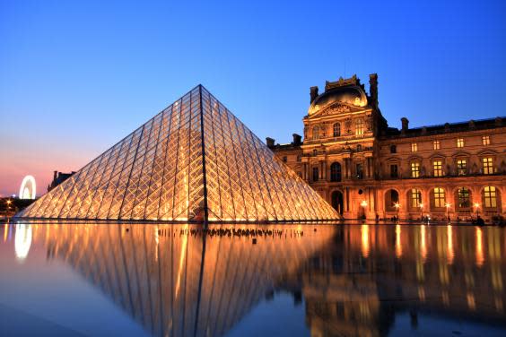 The Paris Louvre by night (Getty Images)