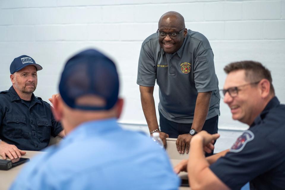 Highland Park Fire Department Chief Erik Hollowell, center, talks with (left to right) firefighter Marcus Schirr, Lt. Bryan Jeffrey and firefighter Marcus Pasquinelli while attending an official monthly luncheon at the Ernest T. Ford Field House in Highland Park on Fri., May 3, 2024.