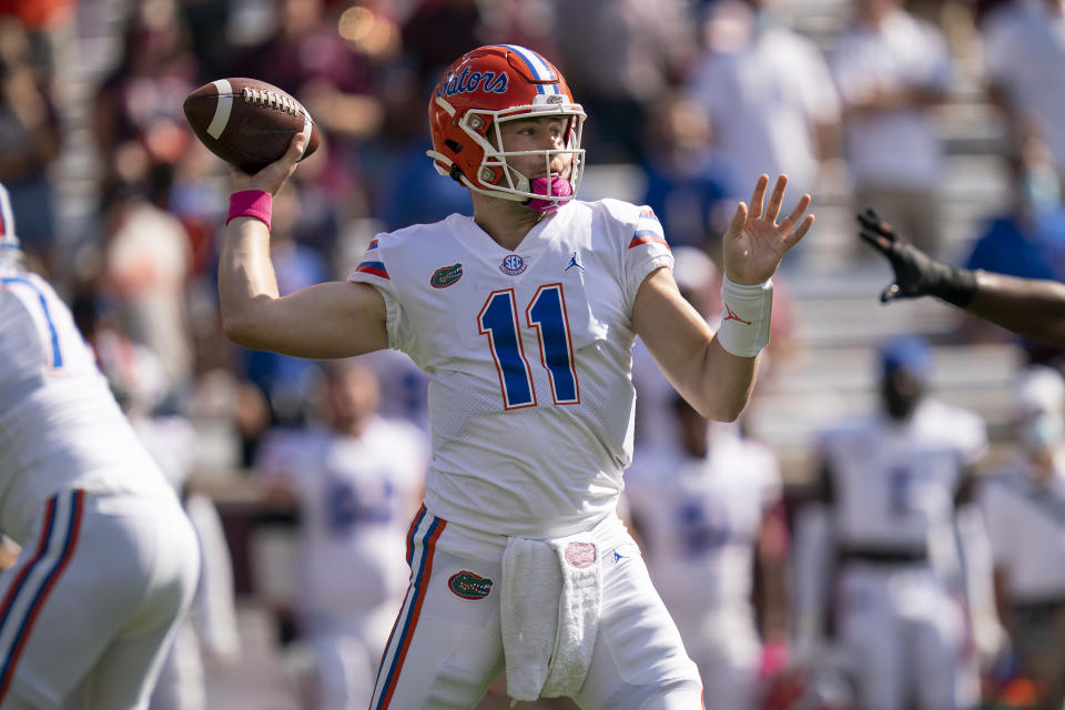 Florida quarterback Kyle Trask (11) pass down field during the first quarter of an NCAA college football game against Texas A&M, Saturday, Oct. 10, 2020. in College Station, Texas. (AP Photo/Sam Craft)