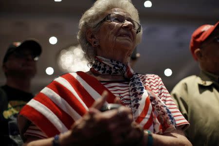 A supporter of U.S. Republican presidential nominee Donald Trump looks on as he speaks at a campaign rally in Pueblo, Colorado, U.S., October 3, 2016. REUTERS/Mike Segar