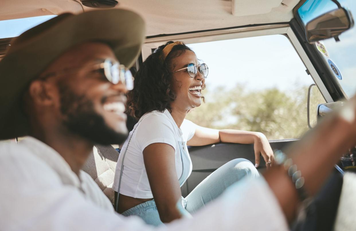 Travel, road trip and black people couple driving by countryside for holiday, journey and freedom with happiness. Trendy sunglasses, fashion and gen z friends in a car drive for vacation lifestyle