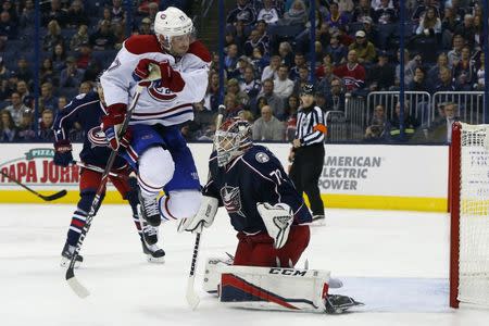 Nov 4, 2016; Columbus, OH, USA; Montreal Canadiens center Torrey Mitchell (17) jumps to avoid the shot in front of Columbus Blue Jackets goalie Sergei Bobrovsky (72) during the third period at Nationwide Arena. Columbus shutout Montreal 10-0. Mandatory Credit: Russell LaBounty-USA TODAY Sports