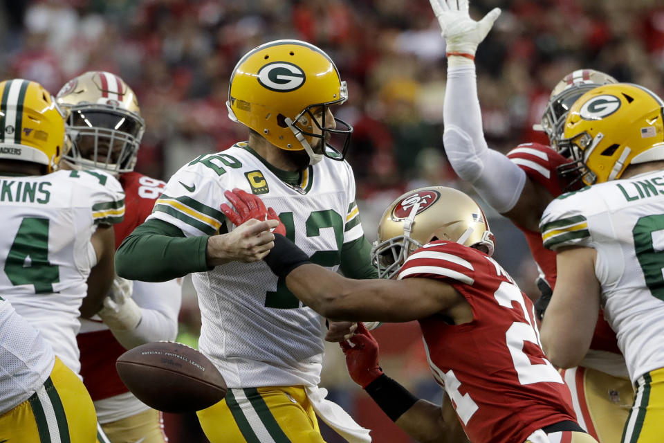 San Francisco 49ers defensive back K'Waun Williams, right, knocks the ball away from Green Bay Packers quarterback Aaron Rodgers during the first half of the NFL NFC Championship football game Sunday, Jan. 19, 2020, in Santa Clara, Calif. The Packers recovered. (AP Photo/Marcio Jose Sanchez)