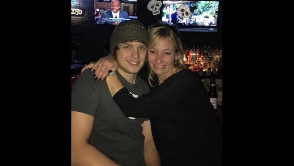 Christi Stevens, the mother of Andrew Niziol, hugs her son at a goodbye party held in New York in 2017. Niziol was leaving New York to come to California and Arizona. He died in a hiking accident atop Mount Whitney on May 7, 2024.