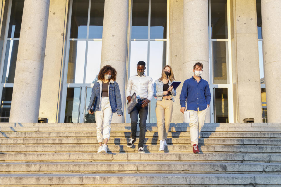 Students walking down stairs on their campus