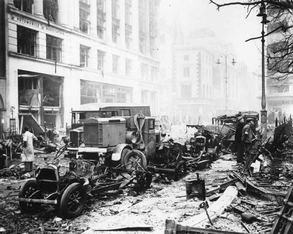 The burned-out wrecks of London taxicabs in Leicester Square reflect the damage done by the German firebombing night raids on Britain's capital, November 8, 1940