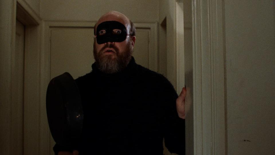 Paul Bartel as Paul Bland, masked, in Eating Raoul