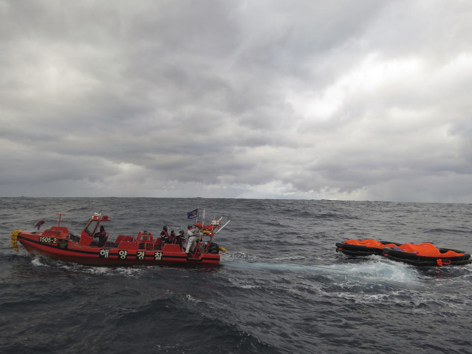 In this photo provided by the Korea Coast Guard, a South Korea coast guard vessel conducts a search operation in waters between South Korea and Japan, Wednesday, Jan. 25, 2023. South Korean and Japanese coast guards were searching for crew members of a cargo ship that sank early Wednesday in waters between South Korea and Japan, South Korean officials said Wednesday. (The Korea Coast Guard via AP)