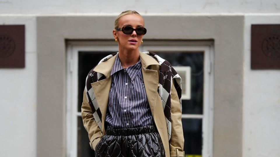 Woman wearing a trench coat with quilted skirt 