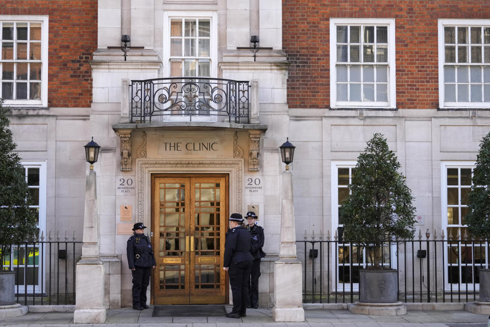 Police officers stand outside an entrance to The London Clinic in London, Friday, Jan. 26, 2024. Buckingham Palace says King Charles III been admitted to a private London hospital to undergo a "corrective procedure" for an enlarged prostate. The 75-year old king will be treated at the London Clinic, where the Princess of Wales is recovering after undergoing abdominal surgery. (AP Photo/Kirsty Wigglesworth)