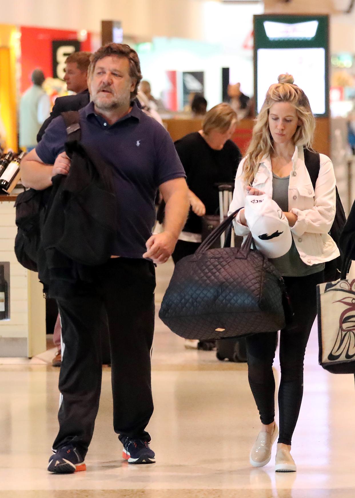 Russell Crowe and Britney Theriot touched down in Sydney on Friday. Photo: Diimex