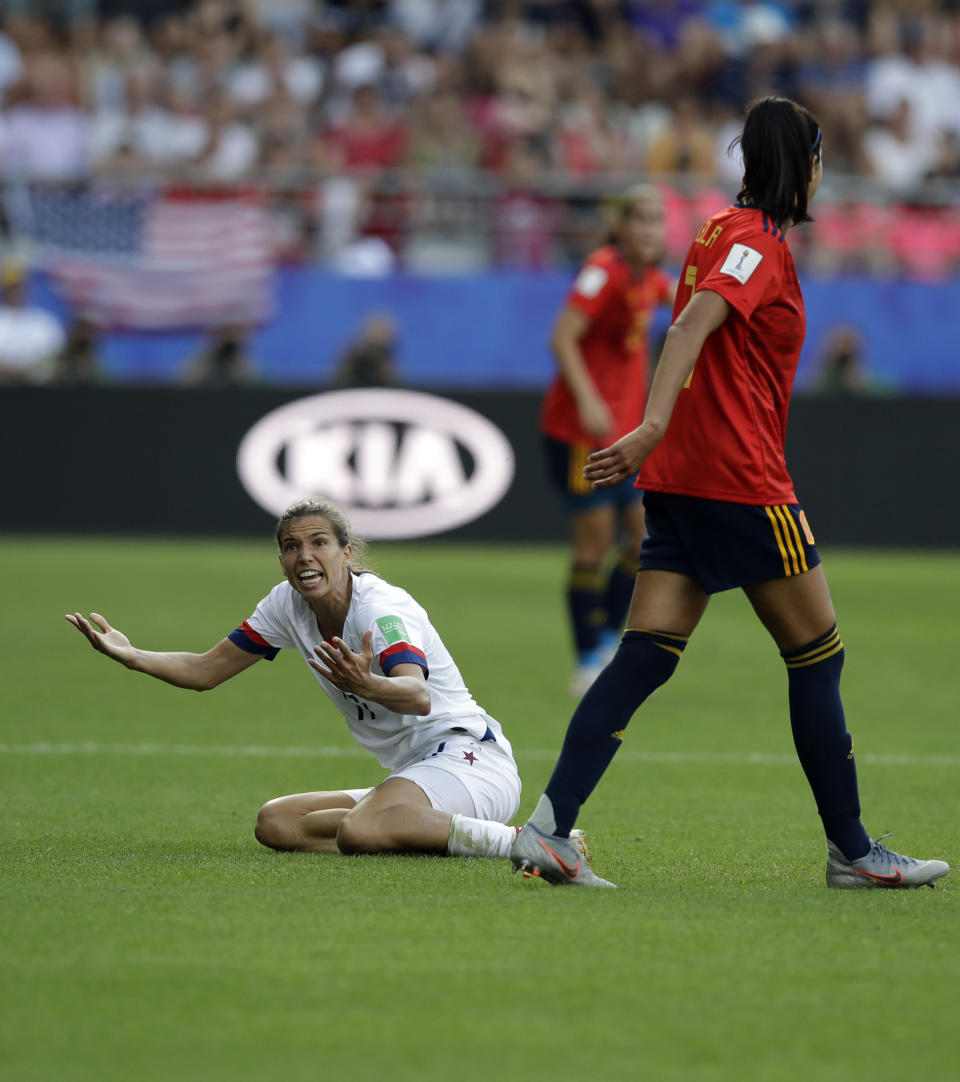 United States'Tobin Heath, left, reacts after a foul by Spain's Leila Ouahabi during the Women's World Cup round of 16 soccer match between Spain and US at the Stade Auguste-Delaune in Reims, France, Monday, June 24, 2019. (AP Photo/Alessandra Tarantino)