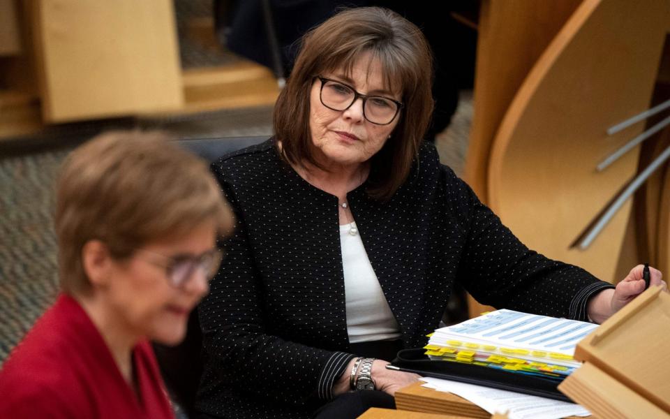 Jeane Freeman and Nicola Sturgeon contradicted each other over the number of available vaccines - ANDY BUCHANAN/AFP