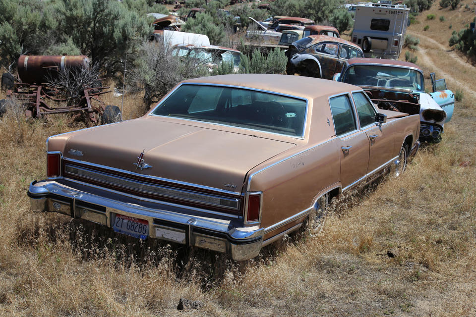 <p>Here’s another incredibly straight car from the same period, which looks like it could be driven straight out of the yard, and onto the highway. Judging by its condition, you’d think it had been parked here yesterday, when in actual fact the sleeping giant arrived at L&L Classic Auto in 2007.</p><p>It’s a 1976 Lincoln Town Car, which weighs a whopping 5344 lb. It needed a 7.5-liter V8 to propel it to 60mph in 12.4sec.</p>