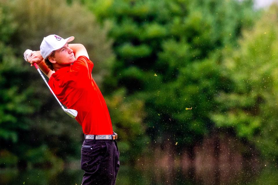 Old Rochester's Peter le Gassick tracks his shot from the fairway on Hole 7 at the Bay Club.