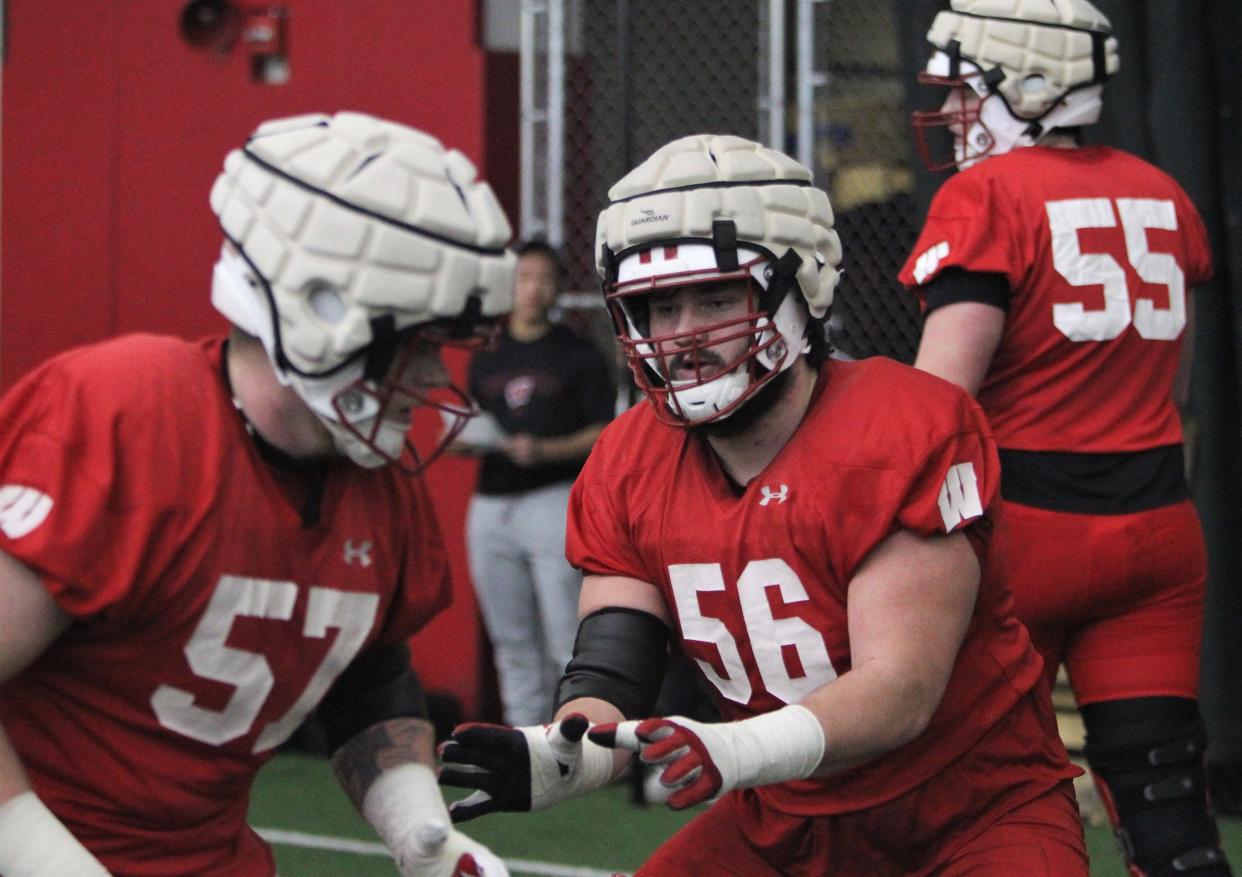 Wisconsin offensive lineman Joe Brunner (56) goes through drills with Jake Renfro during spring practice.