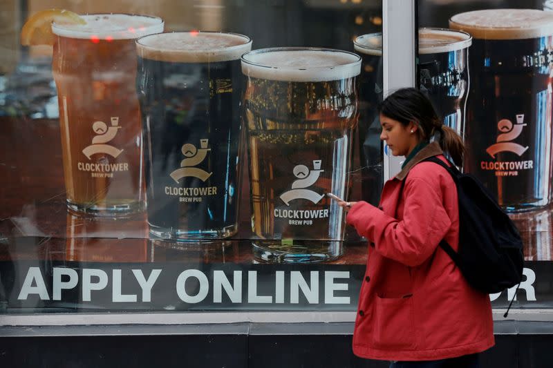 FILE PHOTO: A sign advertising available jobs at the Clocktower Brew Pub hangs in a window in Ottawa