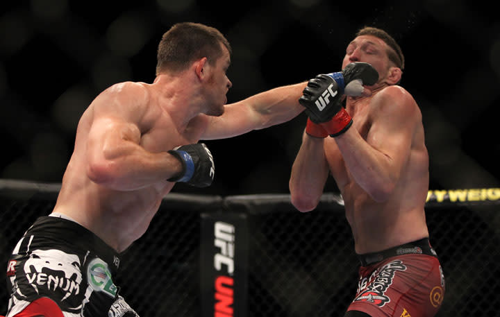 LAS VEGAS, NV - MAY 26: CB Dollaway (left) punches Jason Miller during a middleweight bout at UFC 146 at MGM Grand Garden Arena on May 26, 2012 in Las Vegas, Nevada.