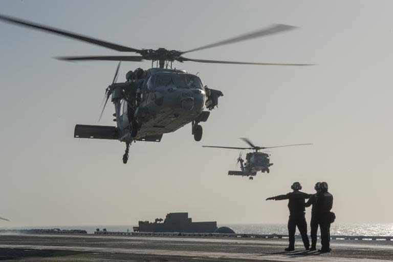 US Navy photo released January 15, 2015 shows an MH-60S Sea Hawk helicopter as it prepares to land on the USS Carl Vinson (CVN 70) in the Gulf