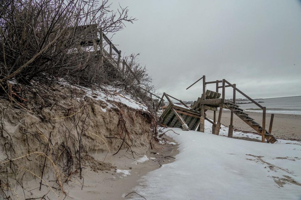 Beach erosion and stairway destruction at Roger Wheeler State Beach in Narragansett on Tuesday.