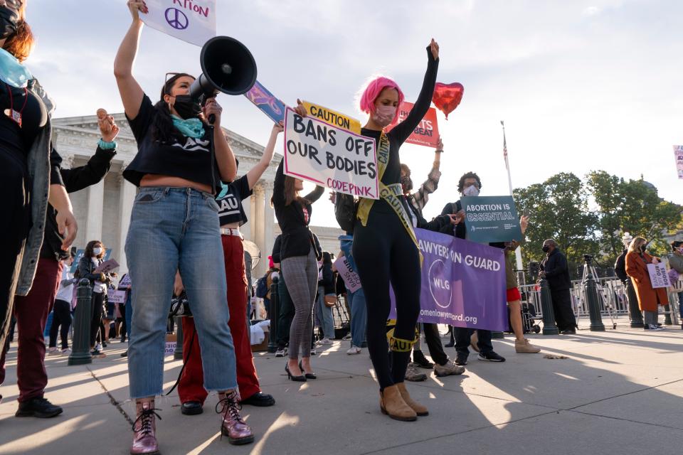 Demonstrators on both sides of the abortion  divide rally outside the Supreme Court on Nov. 1 as arguments are set to begin over state restrictions on the procedure.