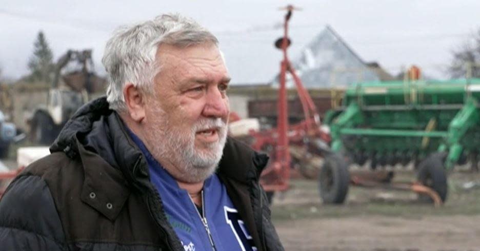 Anatoliy Kozar, 70, speaks with CBS News on his destroyed farm complex on the outskirts of Kubyansk, eastern Ukraine, in March 2023. / Credit: CBS News
