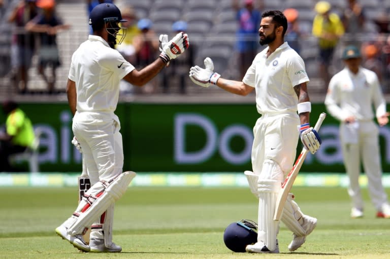 India captain Virat Kohli (right) celebrates his century in Perth with Hanuma Vihari