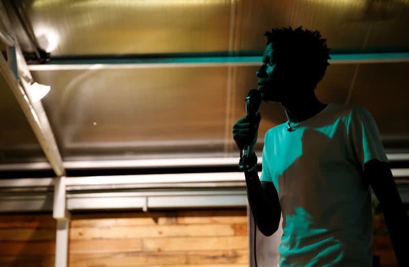 Kenyan standup comedian Brian Onjoro performs during his show at the Kez's Kitchen restaurant in Nairobi