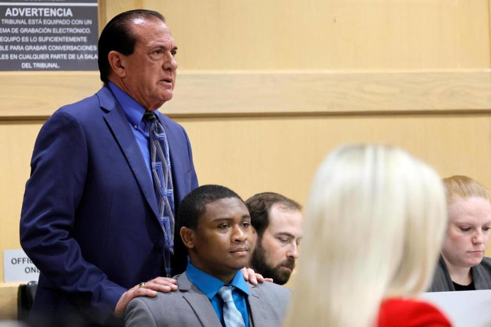 George Edward Reres puts his hands on the shoulders of his client, Trayvon Newsome, as he begins his closing argument in the XXXTentacion murder trial at the Broward County Courthouse in Fort Lauderdale on Tuesday, March 7, 2023. Emerging rapper XXXTentacion, born Jahseh Onfroy, 20, was killed during a robbery outside of Riva Motorsports in Deerfield Beach in 2018 allegedly by defendants Michael Boatwright, Trayvon Newsome, and Dedrick Williams.